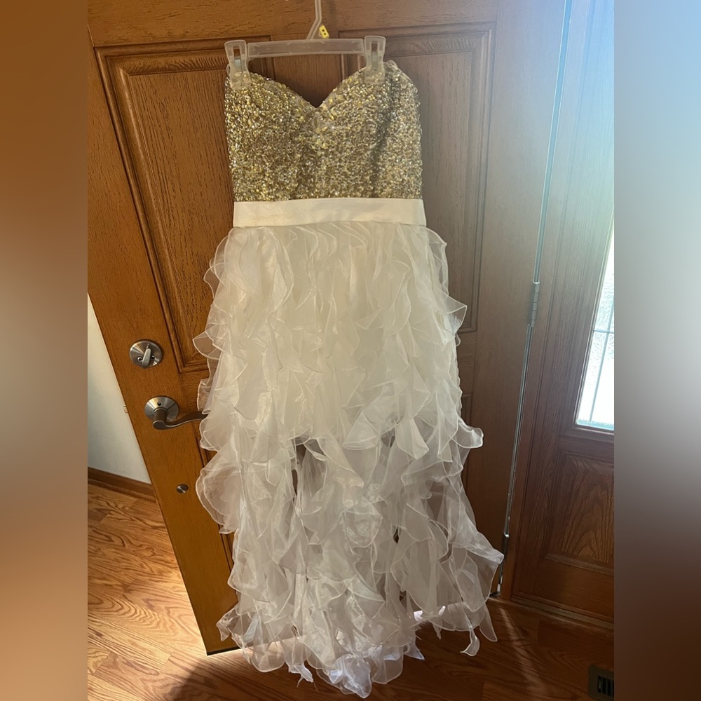 White and gold mini dress with long white ribbon accents